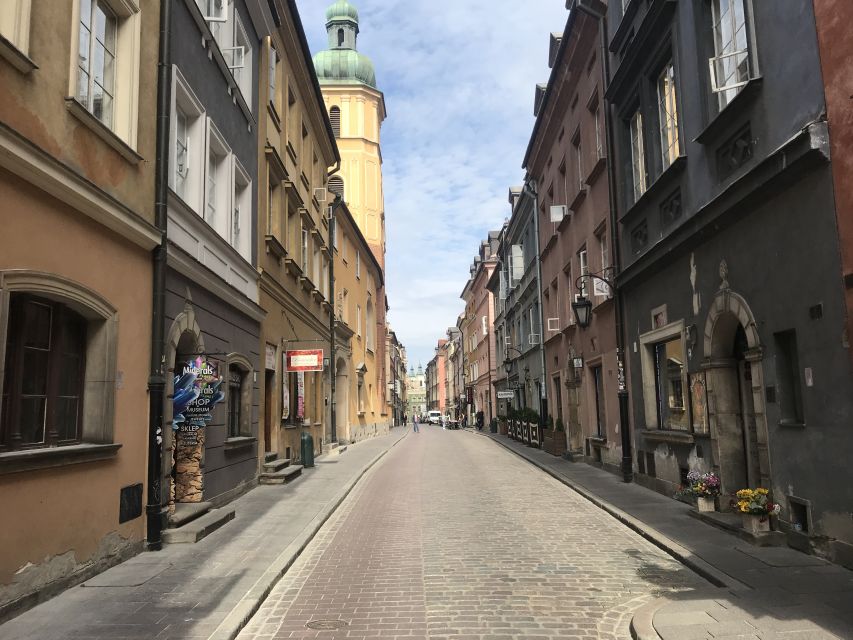 Warsaw: Old Town Guided Walking Tour - Ghetto boundary markers and the Ghetto Wall Monument, memory that requires care